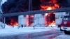 RUSSIA – In this photo taken from video released by Governor of Bryansk Region Alexander Bogomaz telegram channel AV BogomaZ on 19Jan.2024, Russian Emergency Ministry employees work at the side of fire of oil reservoirs after the drone reached Klintsy