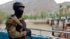 KYRGYZSTAN -- A Kyrgyz soldier guards a water supply facility outside the village of Kok-Tash near Kyrgyzstan-Tajikistan border, May 5, 2021 - AP
